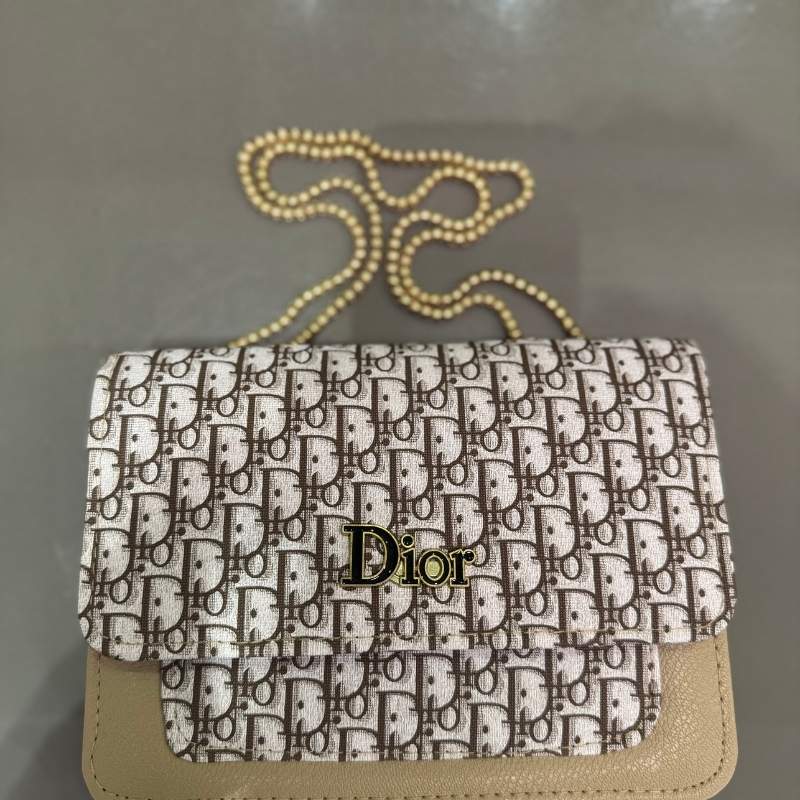 Dior handbag with a patterned design and visible logo on a gray background