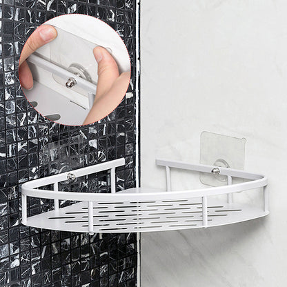 White corner shower caddy attached to a tiled shower wall.
